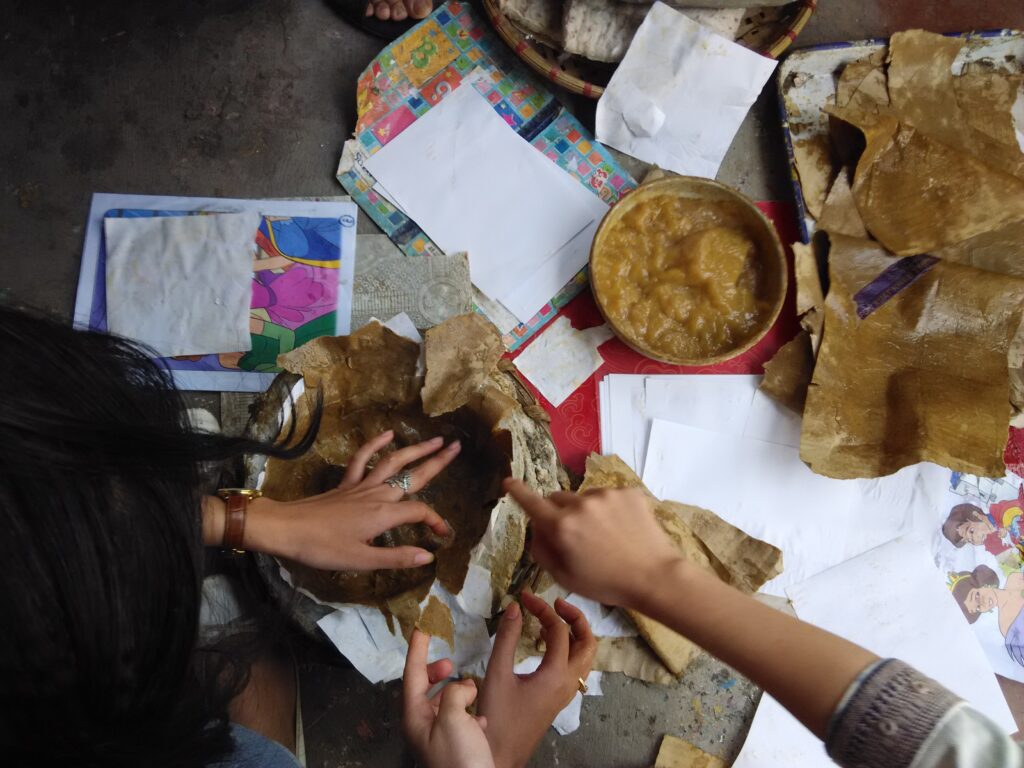 4. Applying the third and final layer of paper